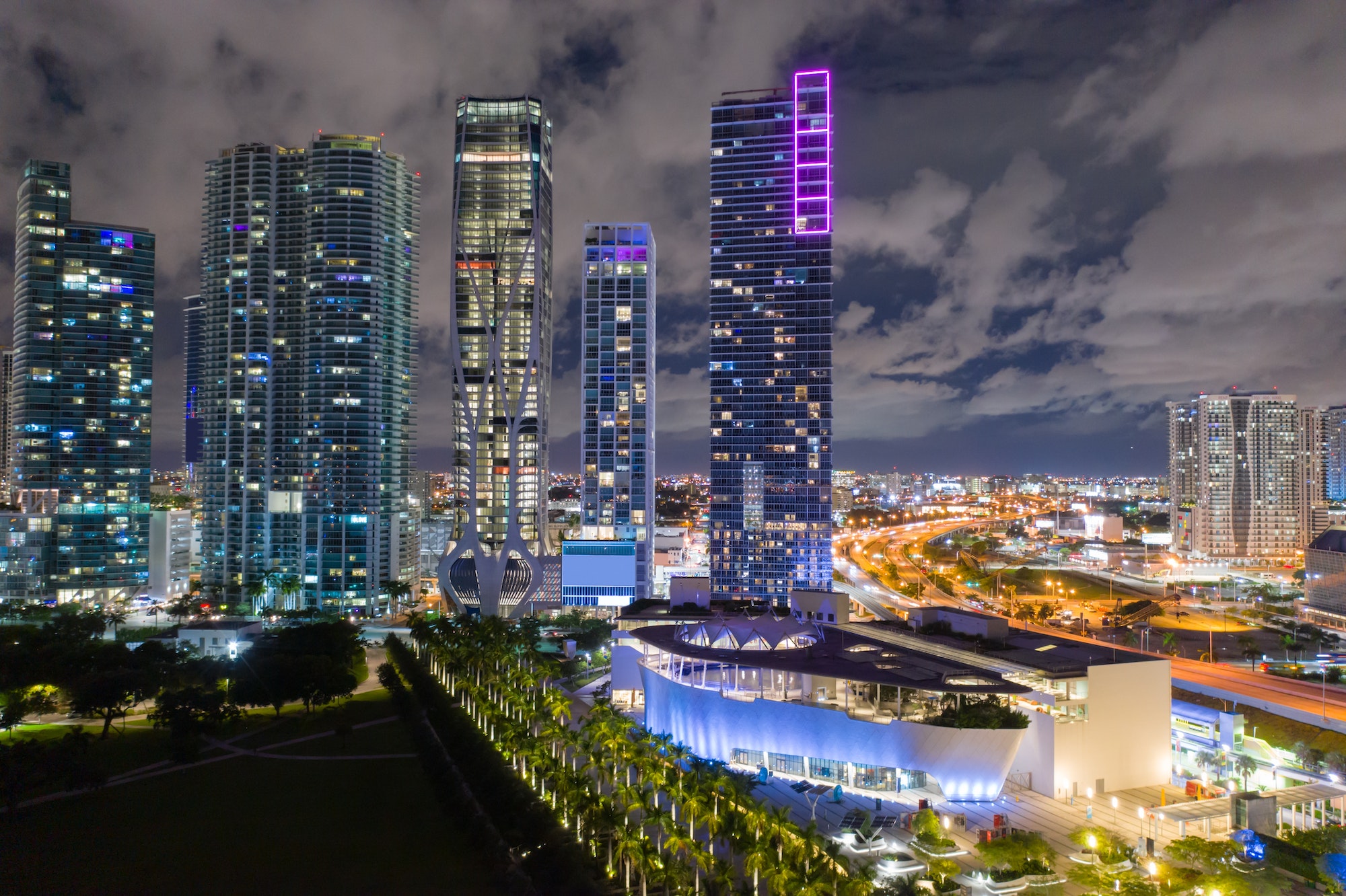 Aerial night photo Downtown Miami Museum Park and highrise buildings neon lights